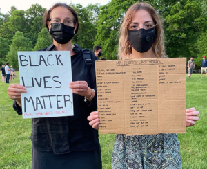 Elaine Reiter and her daughter Leah Berger at the gathering. Leah's sign includes all of George Floyd's words in the last minutes of his life. (Photo by Alice Waugh)