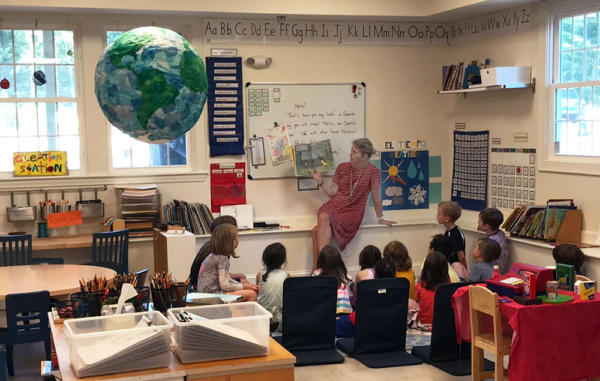 A Birches teacher reads to her class.