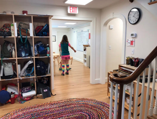 The former foyer of the Wang home is now a place for cubbies and backpacks.